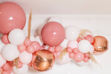 Arch of pink and white balloons; Birthday party decoration for a girl.