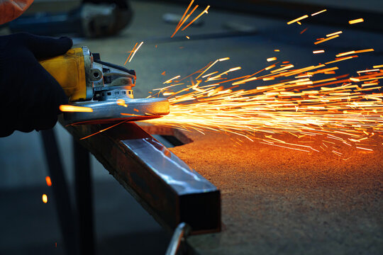grinding a metal with sparks