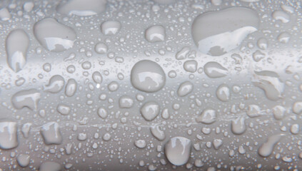 London, United Kingdom, January 25, 2021: Water Drop On, Abstract drops of water on plastic pipe
