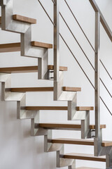 Wooden stairs with silver balustrade
