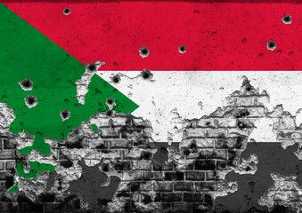 Concept of the Armed Conflict in Sudan with a painted flag on a cracked wall with wholes of...
