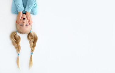 A Little blonde girl with upside down head