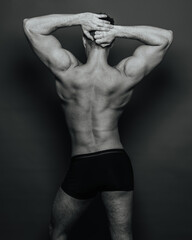 Fototapeta na wymiar Muscular male back in black and white