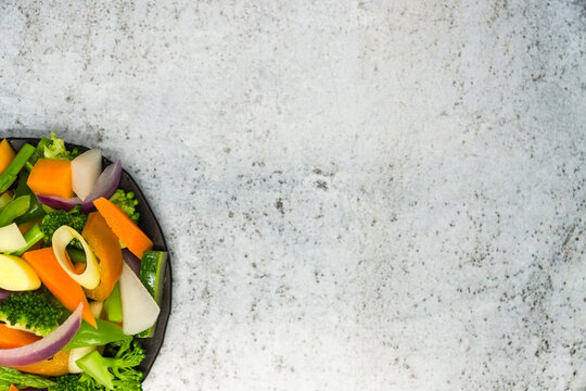 Top View Of Salad Served In A Black Bowl - Healthy Lifestyle