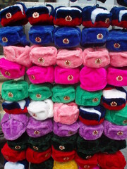 Fototapeta na wymiar colorful winter hats for sale