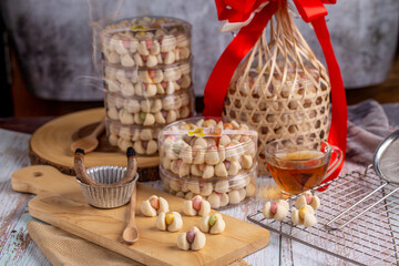 Thai shortbread cookies or Kleeb lamduan (lamduan flower shortbread cookie) served with hot tea.