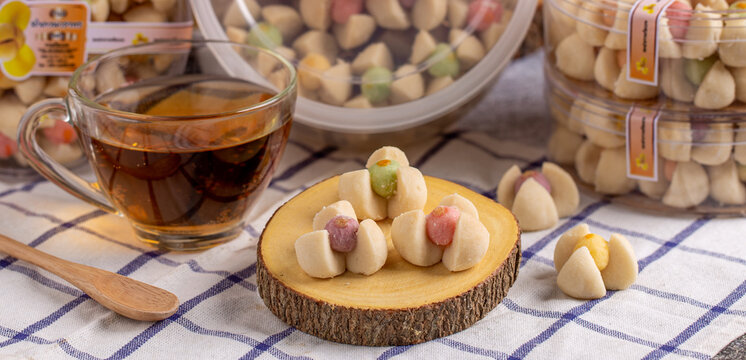 Thai shortbread cookies or Kleeb lamduan (lamduan flower shortbread cookie) served with hot tea.