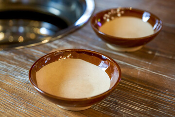 Obraz na płótnie Canvas Ceramic bowl on the dining table for hot pot