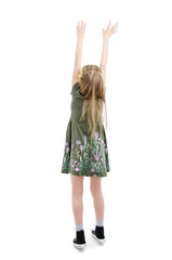 Back view of little girl trying to catch something, isolated on white background