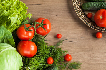 Healthy eating. The concept of healthy food, fresh vegetables on a wooden background. View from above. Copy space.