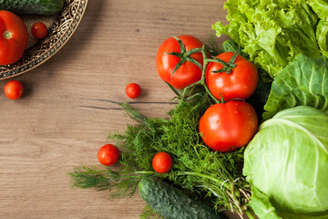 Healthy eating. The concept of healthy food, fresh vegetables on a wooden background. View from above. Copy space.