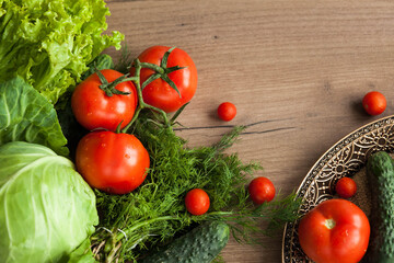 Healthy eating. The concept of healthy food, fresh vegetables on a wooden background. View from above. Copy space.