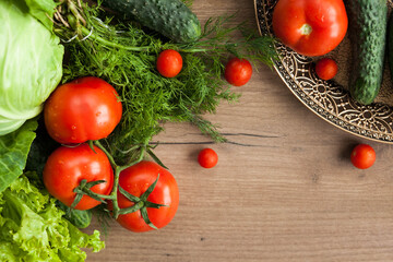Healthy eating. The concept of healthy food, fresh vegetables on a wooden background. View from above. Copy space.