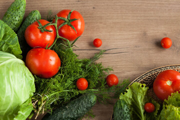 Healthy eating. The concept of healthy food, fresh vegetables on a wooden background. View from above. Copy space.