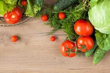 Healthy eating. The concept of healthy food, fresh vegetables on a wooden background. View from above. Copy space.