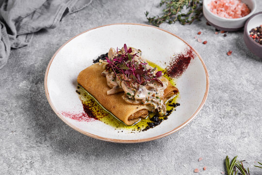 pancaces with mushrooms on stone backgroun