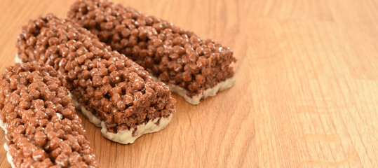 Muesli cereal chocolate snacks pressed from puffed cornes and nuts