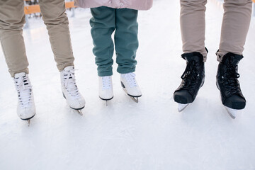 Family standing on skates