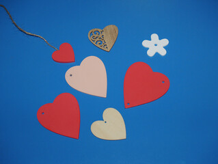 Pink and red hearts on a blue background. Valentine's day.