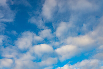 High white cirrus clouds with cirro-stratus in a light blue sky, sometimes called chair tails, indicate nice weather, but stormy changes come within a few days. White clouds in a blue sky. 