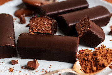 Glazed curds chocolate on plate. Dessert chocolate with glazed cheese