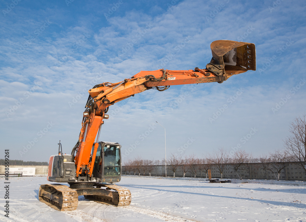 Wall mural large working machine is a tracked excavator