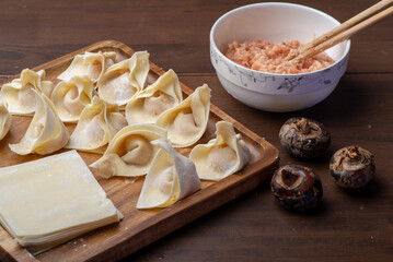 The chef is making meat wonton