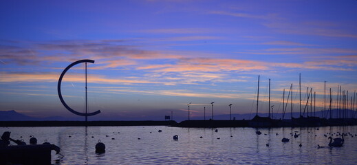 Sunset in Ouchy Lausanne, Geneva Lake backlighting in blue color.