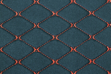 Fototapeta premium Stylish black square leather texture with red stitched line.