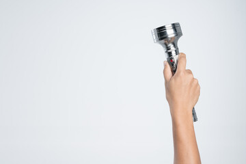 Hand holding vintage aluminium flashlight