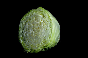 Half cut cabbage with black background