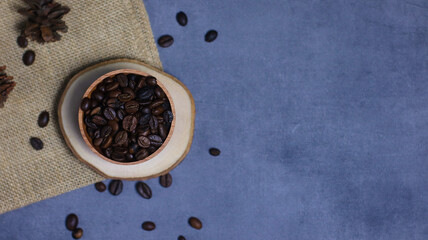 coffee beans on a wooden bowl and burlap