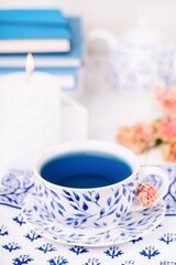 Porcelain cup of organic blue butterfly pea flower tea