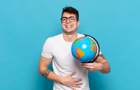 young man laughing out loud at some hilarious joke, feeling happy and cheerful, having fun