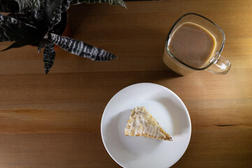 Overhead breakfast shot with glazed scone and coffee.