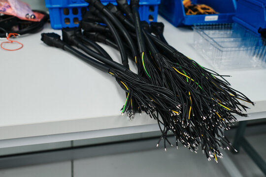 collection of black, green and yellow cables on a table