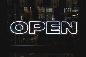 The word Open designed with white neon lights. Safety and trust concept.