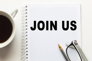 Notepad with inscriptions JOIN US on a white background. business concept.