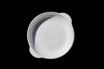 White plate with black  color background.