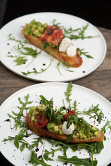 Healthy vegetarian bruschetta with vegetable and cheese.