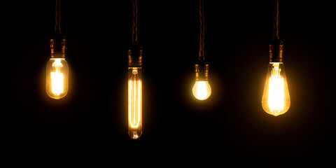 Set of vintage glowing light bulbs on black background. Retro luxury interior bulb. Electricity concept.