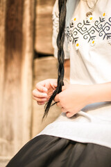 close up woman with long braid