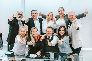 group of happy employees celebrating their success.