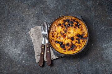 Latin American Corn pie. Chilean Pastel de Choclo in clay bowl
