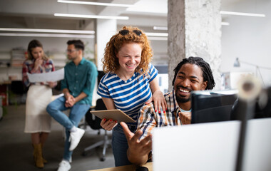 Group of business people and software developers working as a team in office