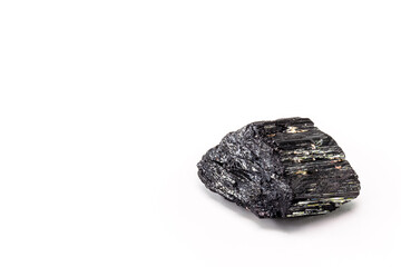 Brazilian black tourmaline, isolated over white background. Decorative esoteric crystal with mystical properties, protective stone.