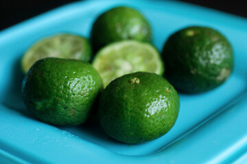 close up of limes on a plate