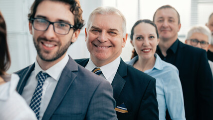 close up. a team of experienced employees standing in line