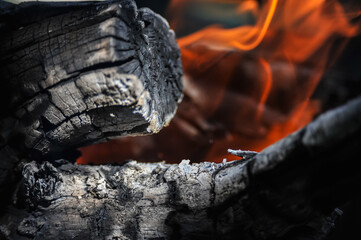 Dry logs burn on fire - low key stock photo