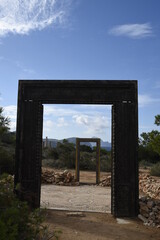 Doors to heaven in Cala Llentia, Ibiza. Es Vedra on the background